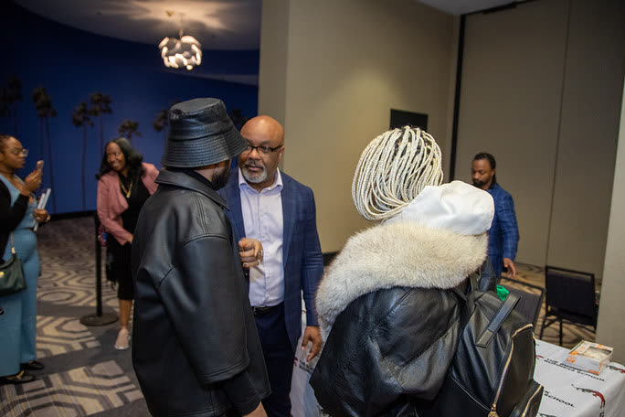 Dr. Boyce Watkins networking with attendees at the All-Black National Convention
